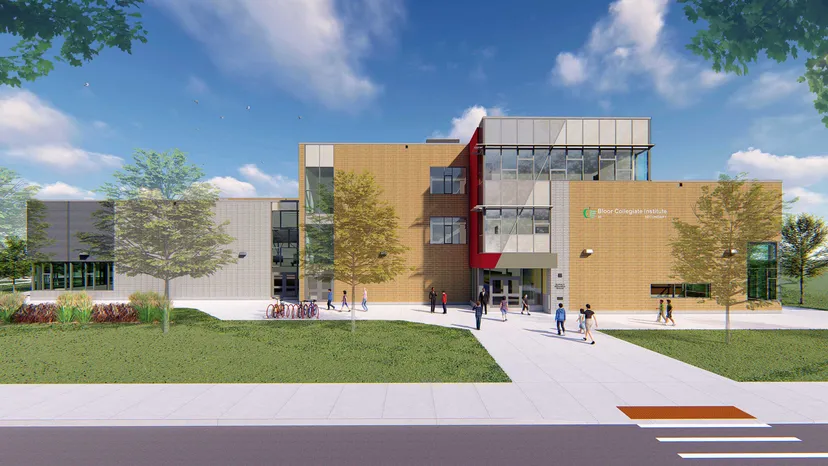 L'edificio moderno a più piani del Bloor Collegiate Institute si trova immerso in un ambiente verde con alberi e un viale pavimentato.