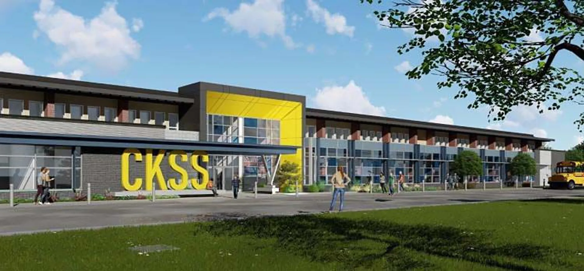 L'edificio moderno a più piani della Chatham Kent Secondary School con un cartello giallo e circondato da aree verdi.